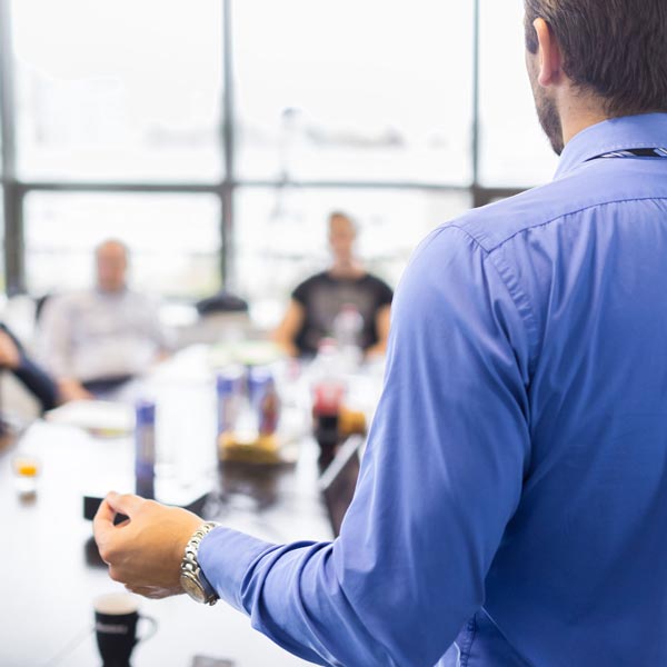 person talking to group
